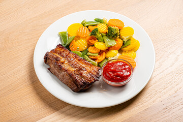 Meatloaf with a side of vibrant steamed veggies and dipping sauce