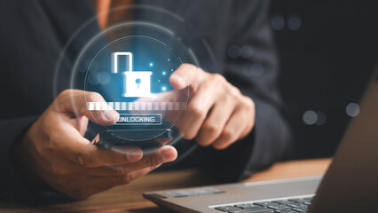 Businessman unlock success idea, creativity concept, Hand holding unlock virtual icon graphic Business innovation and technology concept. Key of Success business concept. 
