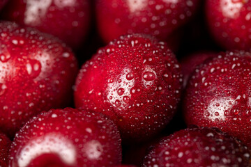 cherry in drops of water, wet cherry fruits on the kitchen table