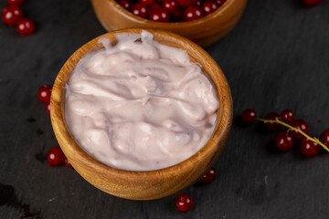 yogurt and ripe currants, a red fermented milk product made from milk with the addition of red sweet and sour currants