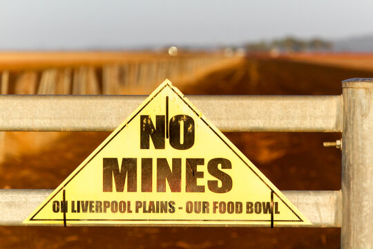 Protest sign on farm gate - No Mines.