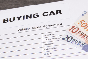 Vehicle sales agreement and euro banknotes. Sales, purchases new or used vehicle