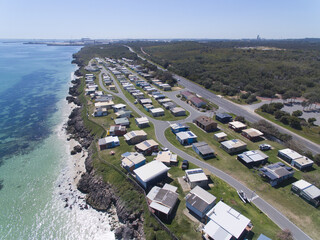 Aerial view over Naval Base shacks and challenger beach