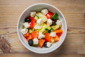 Crisp lettuce, juicy tomatoes, and creamy feta create a delightful medley of flavors and textures