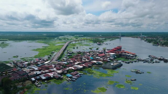 Aerial View of Bellavista&ndash;Nanay District, New Puente Nanay Bridge, and Flooded Iquitos. This footage showcases the northern part of Iquitos, including the Bellavista&ndash;Nanay district and the new bridge