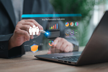 KPI Reports with AI and Data analytics automated concept, Businessman shows the dashboard for Automating Data Management of key performance indicator tracking database, Sales Marketing report