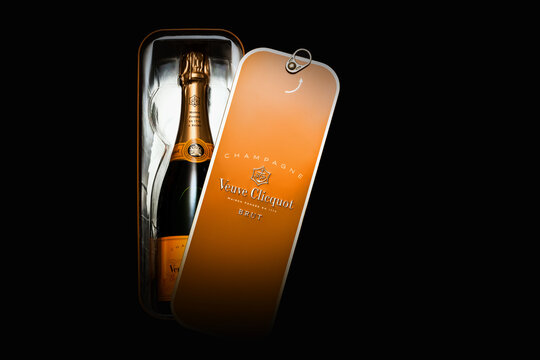 Luxurious Veuve Clicquot LVMH champagne bottle in elegant high-quality gift box for celebrations, parties and special occasions on a dark background