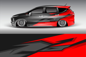Sleek modified car with striking red and black graphics, showcasing custom design and lowered stance