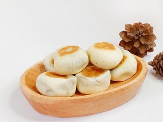 Bakpia isolated on white background. Bakpia is a traditional food with various fillings such as green beans, chocolate, cheese etc.