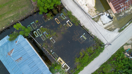 Flooded cemetery with grave markers from an aerial perspective 