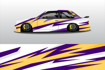 Stylishly modified car with vibrant purple and yellow graphics parked against a minimalist background