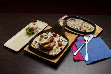 Set of potato pancakes with mushrooms, meat in sauce and dessert