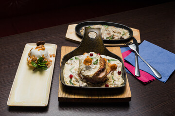 Set of potato pancakes with mushrooms, meat in sauce and dessert