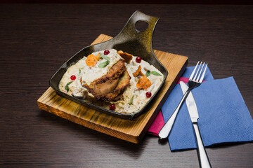 Draniki with chanterelle mushrooms, cream sauce and meat
