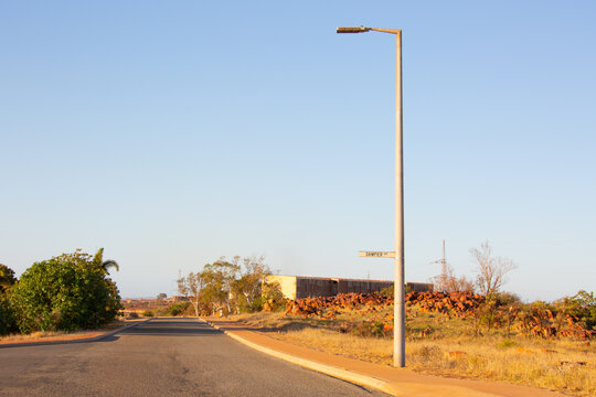 Desolate street scene with street light and road sign