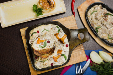 Set of potato pancakes with mushrooms, meat in sauce and dessert