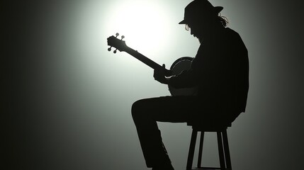 silhouette of musician playing banjo