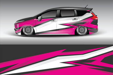 Stylishly modified car with vibrant graphics parked against a sleek gradient background