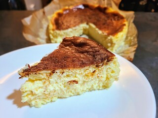 Basque Burnt Cheesecake Slice on Plate Eye Level View