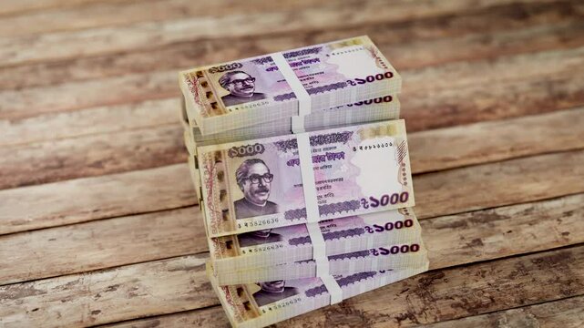 Bangladeshi currency moving in the background. 3D animation of banknote Close-Up 4K Stock Footage. one thousand taka rotating concept of finance and money