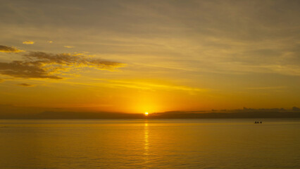 Stunning sunset over calm ocean waters