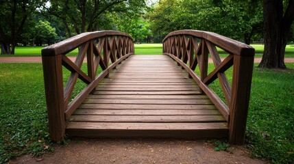 Fototapeta premium Tranquil Wooden Bridge in a Serene Park