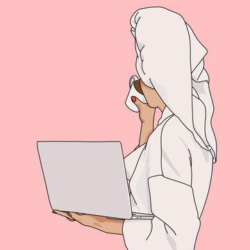 Woman in Towel Working on Laptop