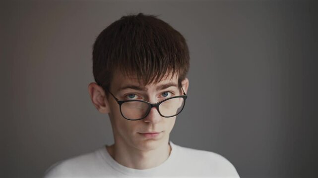 Young Man in Glasses Raising Eyebrows and Shaking Head No