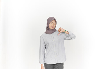 Showing thumbs down, disagree sign Of Beautiful Asian Woman Wearing Hijab Isolated On White...