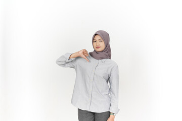 Showing thumbs down, disagree sign Of Beautiful Asian Woman Wearing Hijab Isolated On White...