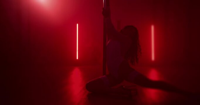 Exotic, dancer and performance in club, flexible and artist with balance for event and woman with skills. Entertainment, private party and rehearsal of routine, performer and person on stage at night