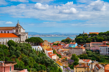 Fototapeta premium Generated imageView of Alfama neighborhood Lisbon. Capital of Portugal. Colourful facades of houses of Lisboa