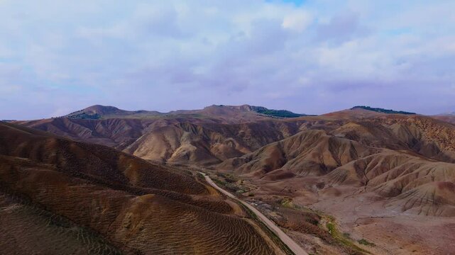 Aerial pull back view of Calanchi del Cannizzola (or Deserto dei Calanchi), known as the &ldquo;Sicilian desert&rdquo;, a series of clay formations in the East part of Sicily