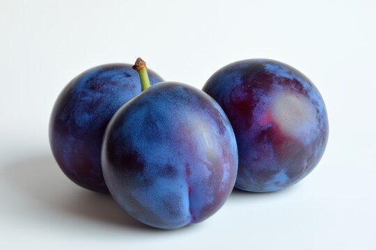 Fresh and Ripe Damson Plums: Whole Purple Fruits for Organic Delight