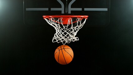 Detail of basketball ball hitting the hoop, top view. Isolated on black background. © Jag_cz