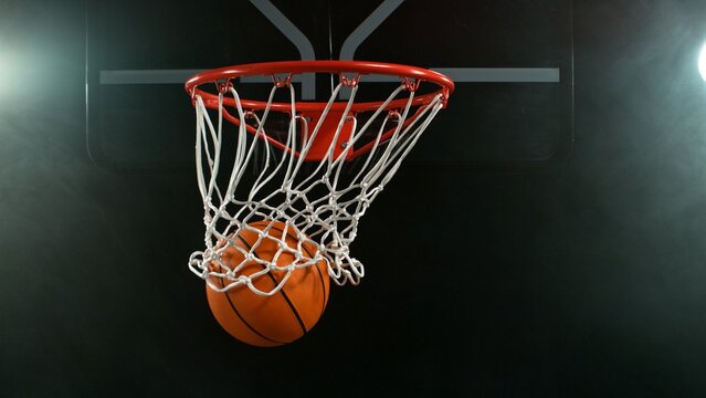Detail of basketball ball hitting the hoop, top view. Isolated on black background. - Powered by Adobe