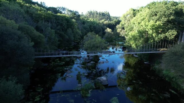Drone View Flying Over Insua de Seivane Suspension Bridge on Mi&ntilde;o River at Summer Sunset - 1313
