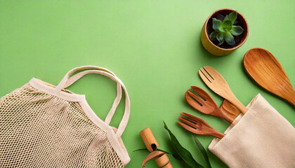 Eco friendly lifestyle flat lay with plant pot, reusable bag and bamboo utensils on green background for World Environment Day