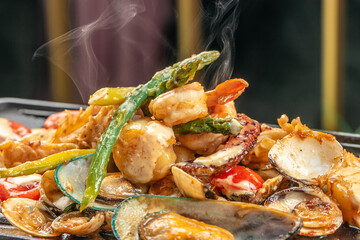 Hot grilled octopus mussels with asparagus. Seafood Dish