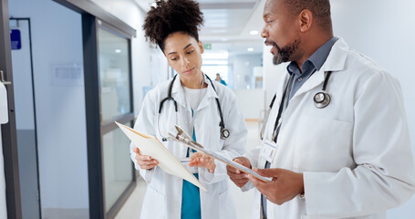 Healthcare, doctors and folder in hospital for advice, diagnosis feedback and patient chart for...