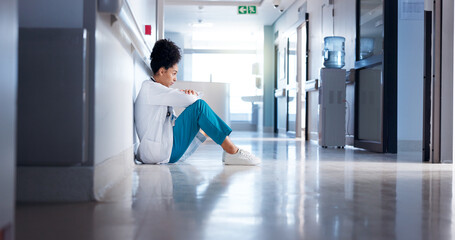 Stress, woman and doctor in hallway, thinking or sad with depression, burnout or challenge. Person,...