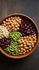 A vibrant medley of legumes and pulses displayed in a rustic wooden bowl, showcasing nature's wholesome bounty and dietary fiber richness.