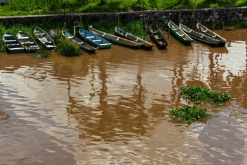 Iguape, SP, Brazil, March 14, 2015. Small fishermen is boats and canoes anchored on the bank of the...
