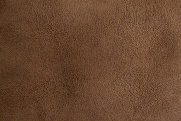 Genuine leather suede skin, textured surface, brown close up parchment structure , abstract backdrop