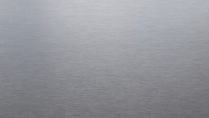 Minimalistic brushed metal texture background with neutral lighting and horizontal grain. Perfect for product mockups, industrial design, or abstract backdrops.