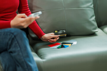 She used her credit card to buy clothes online.