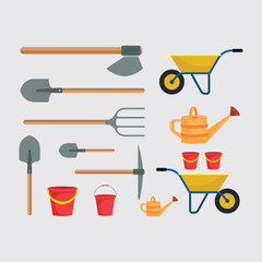 Assorted Gardening Tools and Equipment Including Shovels, Buckets, and Wheelbarrows