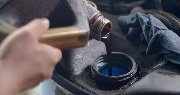 Used oil is poured together to enter the recycling process.Old oil from cars.Dark black oil after long use.
