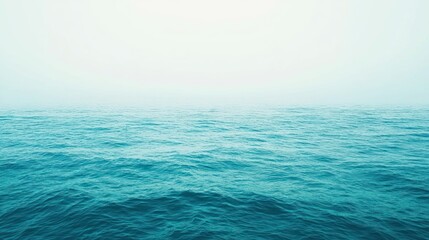 Obraz premium Misty ocean, lone boat, calm waters, foggy horizon, seascape background