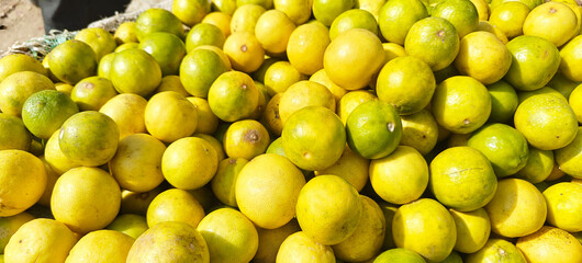 A pile of fresh lemon open sell in Indian market.